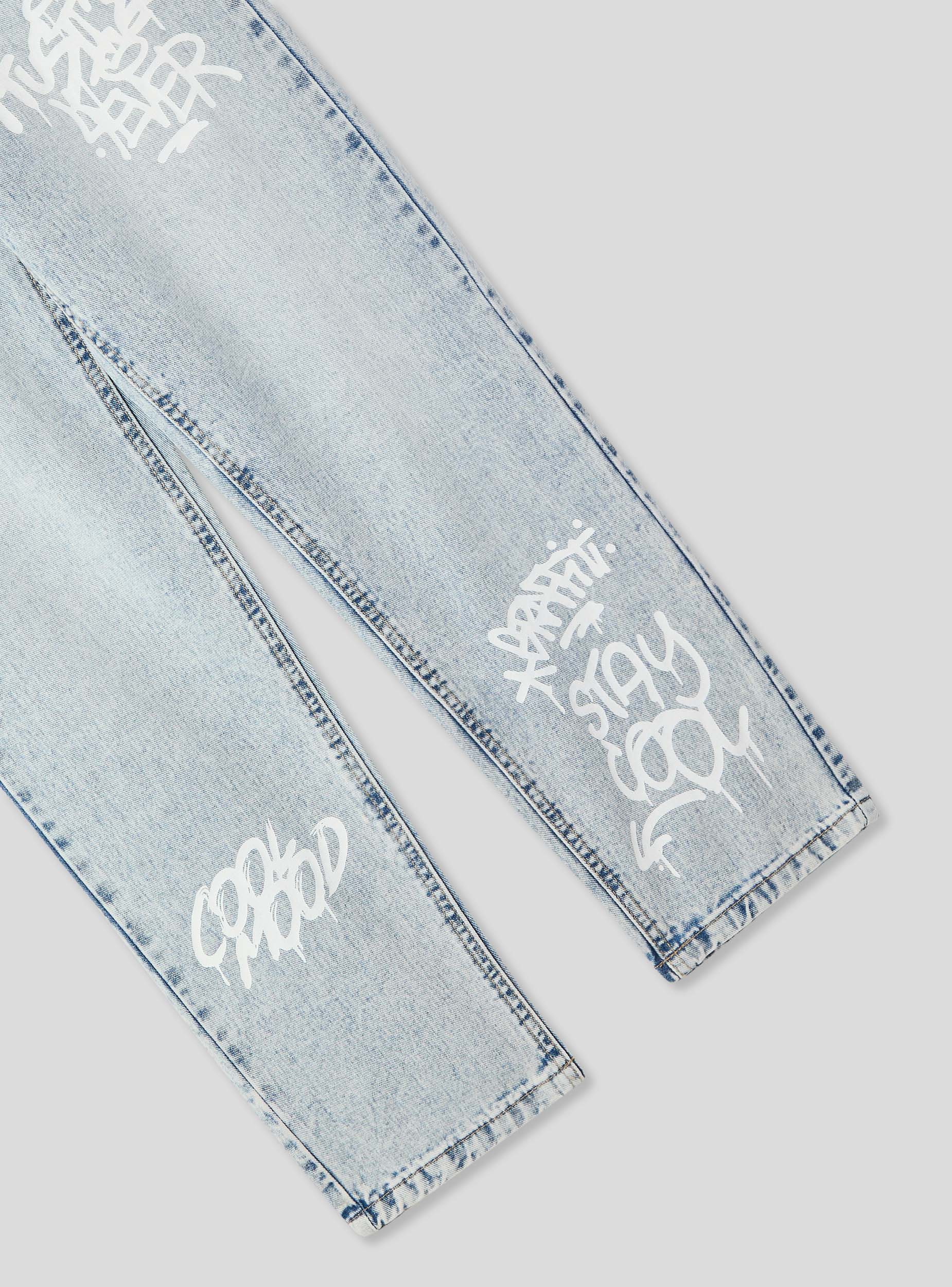 Jeans con strappi e stampe stile graffiti - Image 6