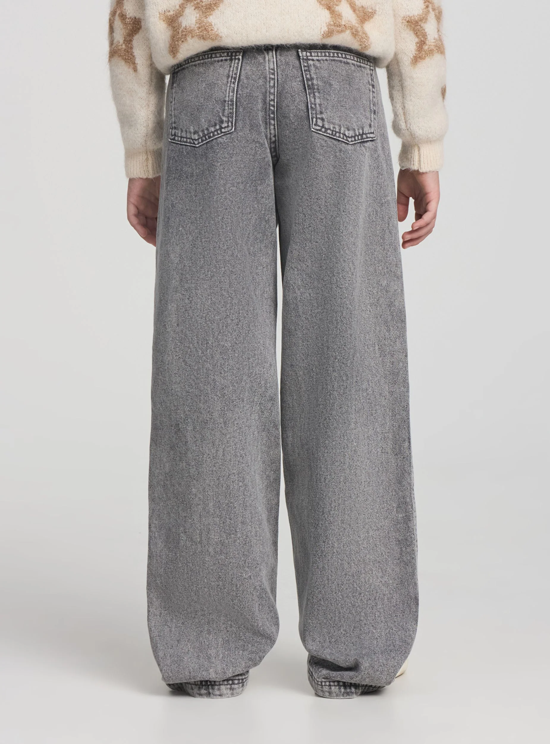 Jeans wide leg con impunture