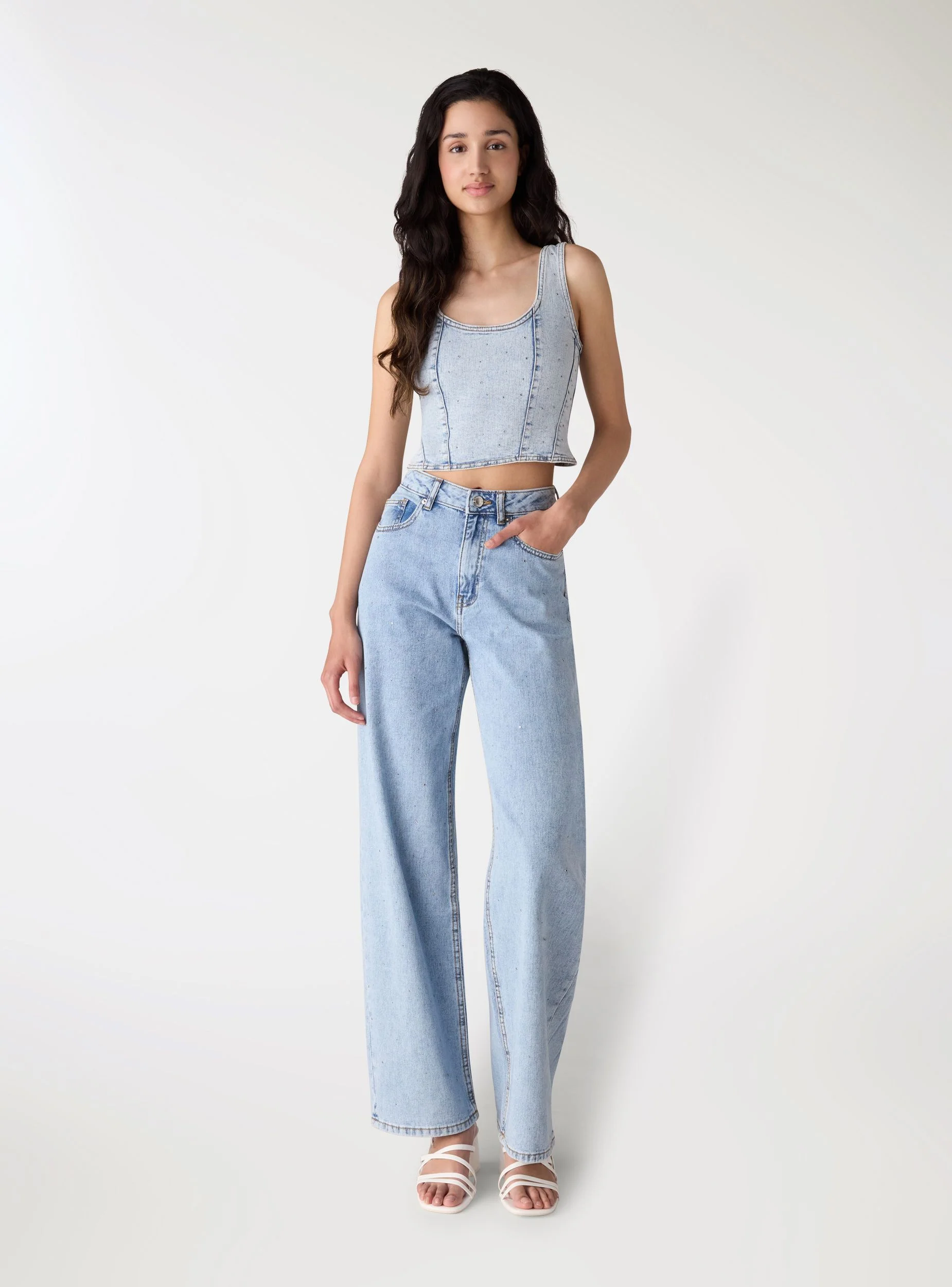 Jeans wide leg con strass allover
