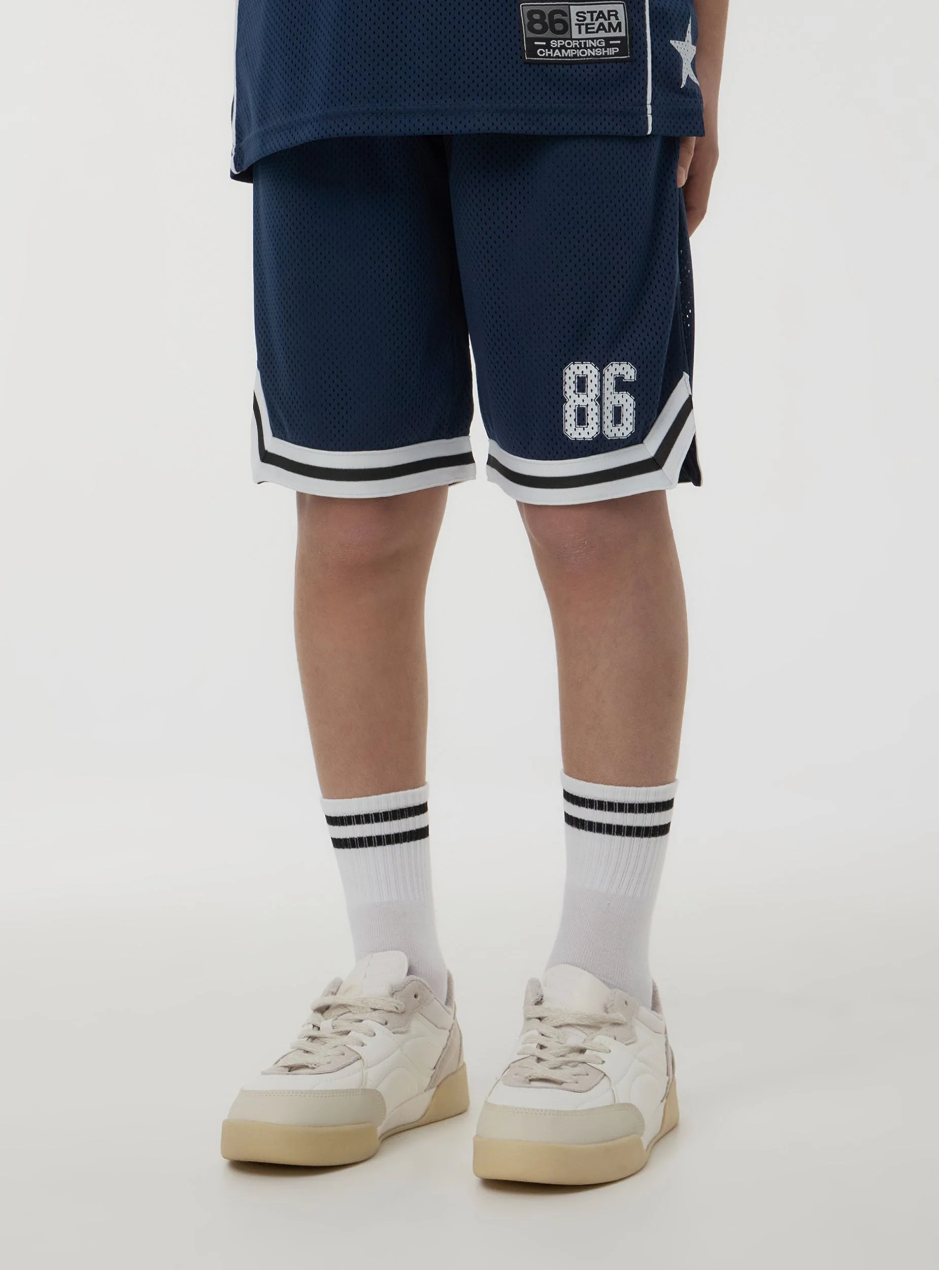 Pantaloncini in rete stile basket