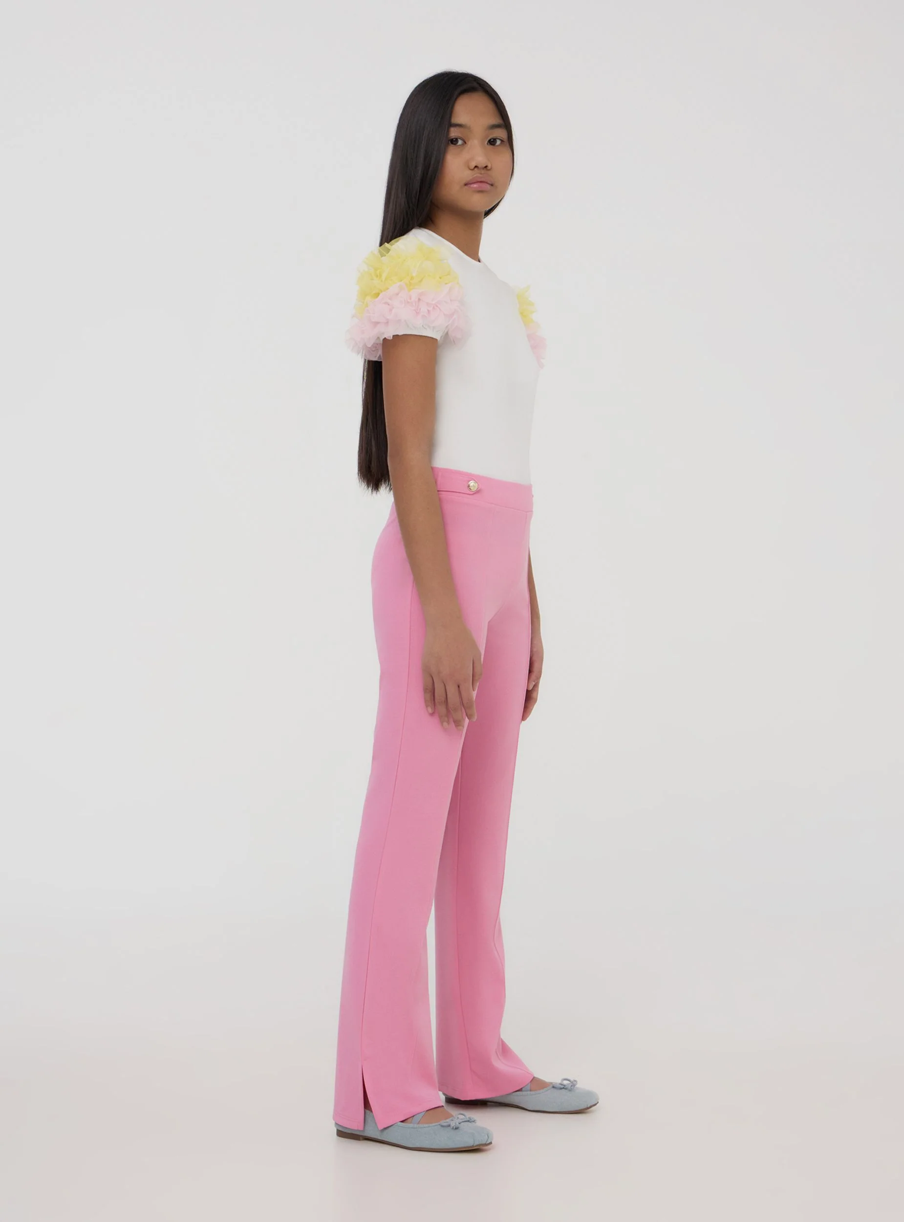 Pantaloni con bottoni decorativi