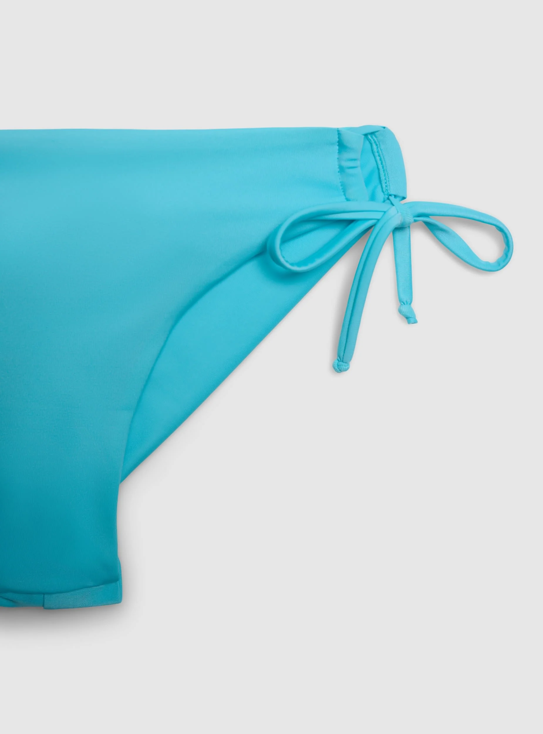 Slip bikini brasiliana con coulisse laterali tinta unita - Image 7
