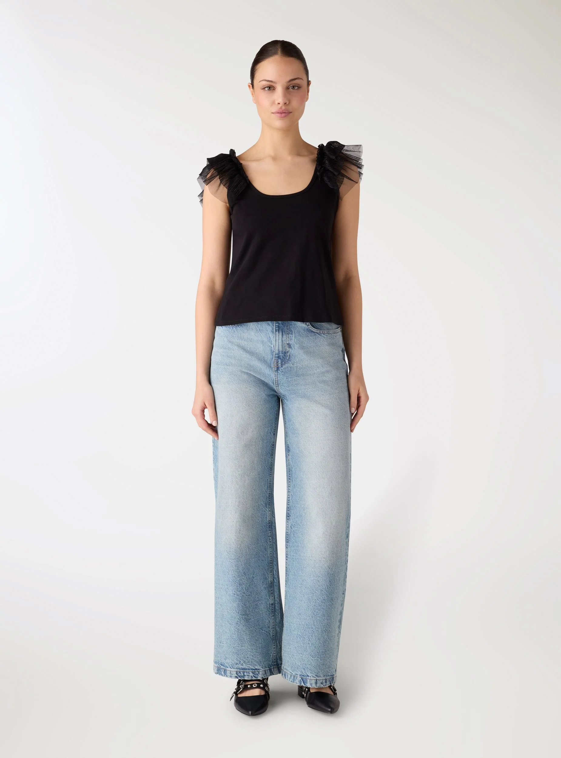 Top con balza in tulle effetto luccicante