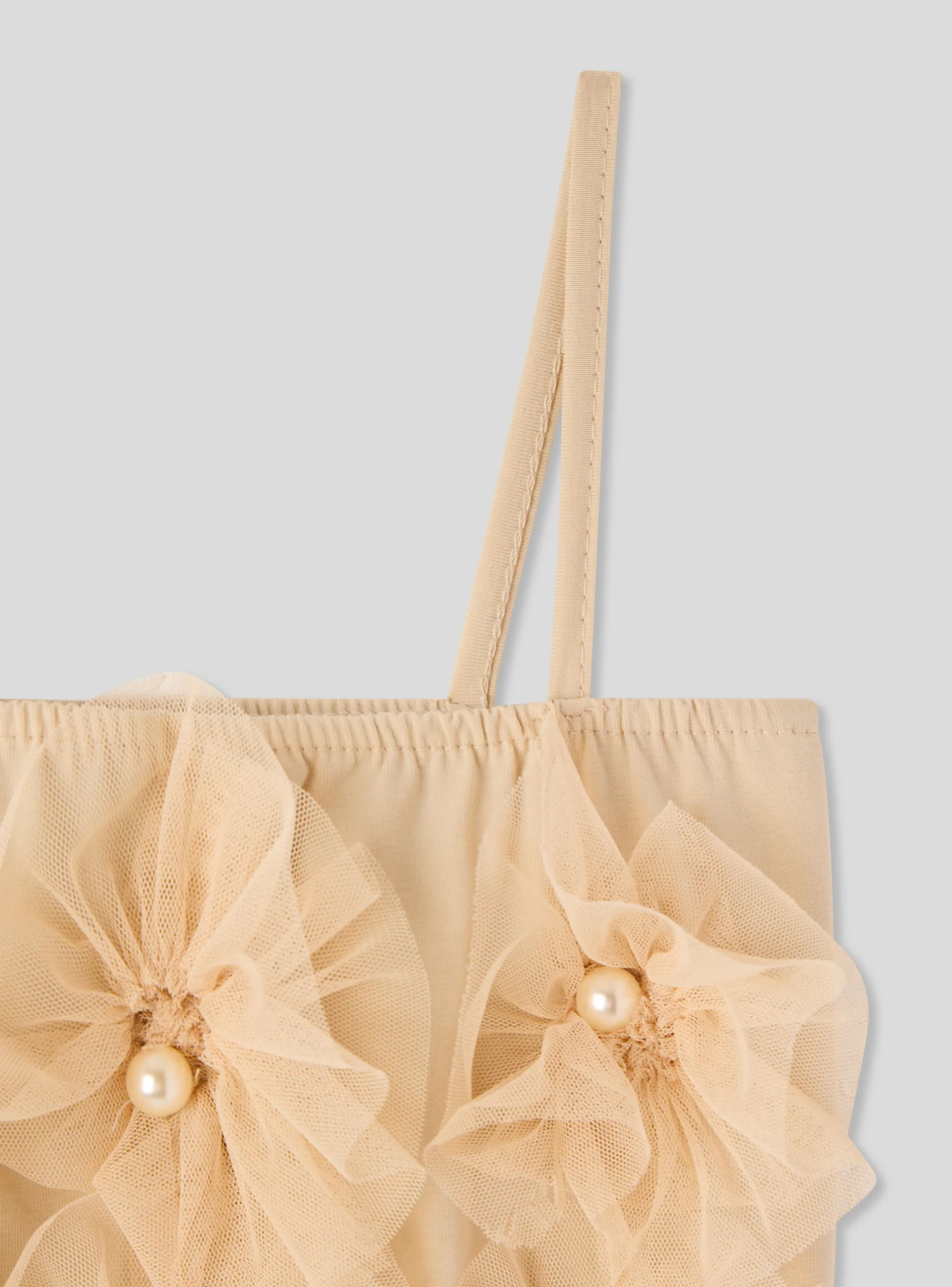 Top con decorazioni floreali in tulle