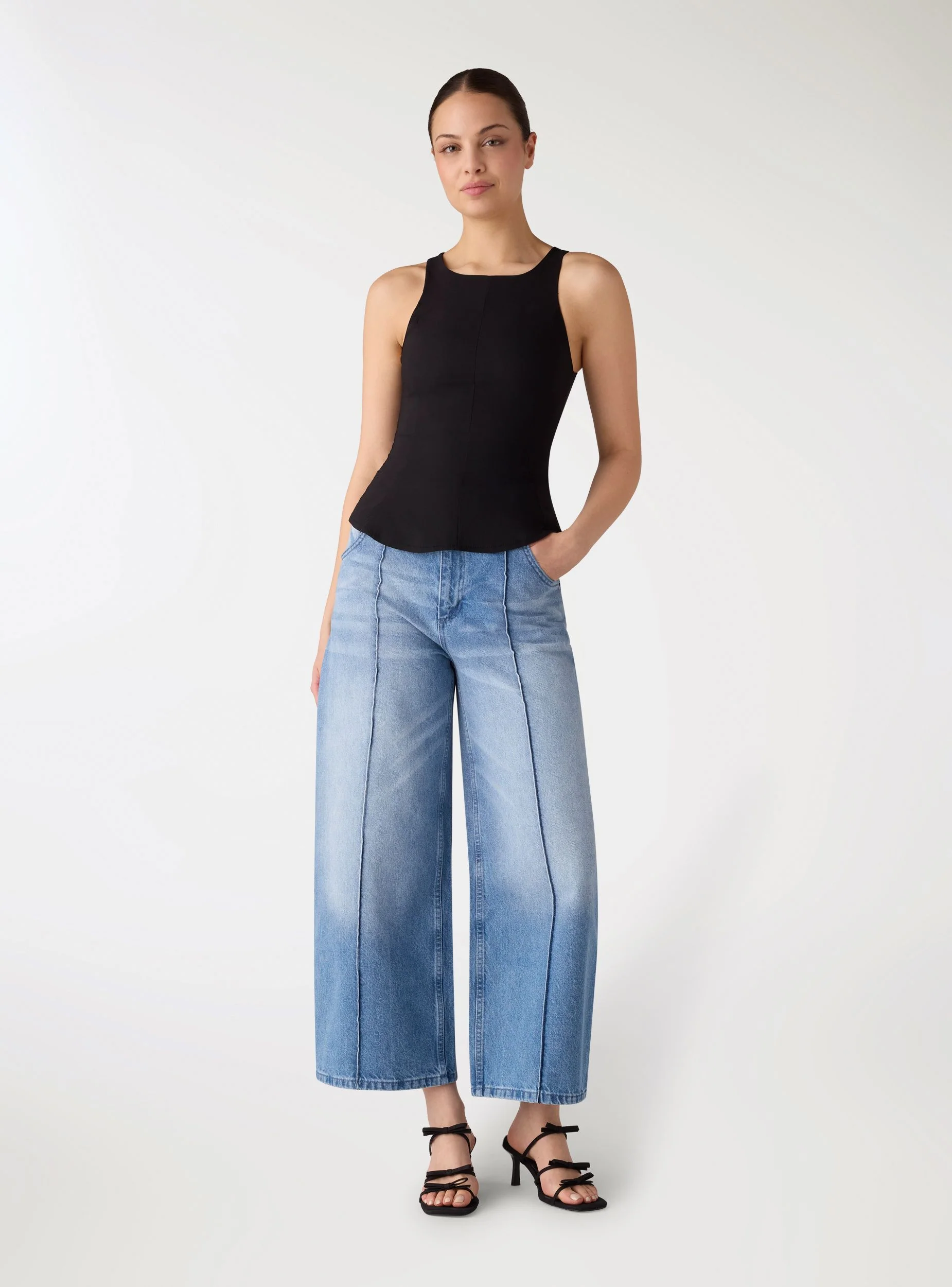 Top peplum a tinta unita